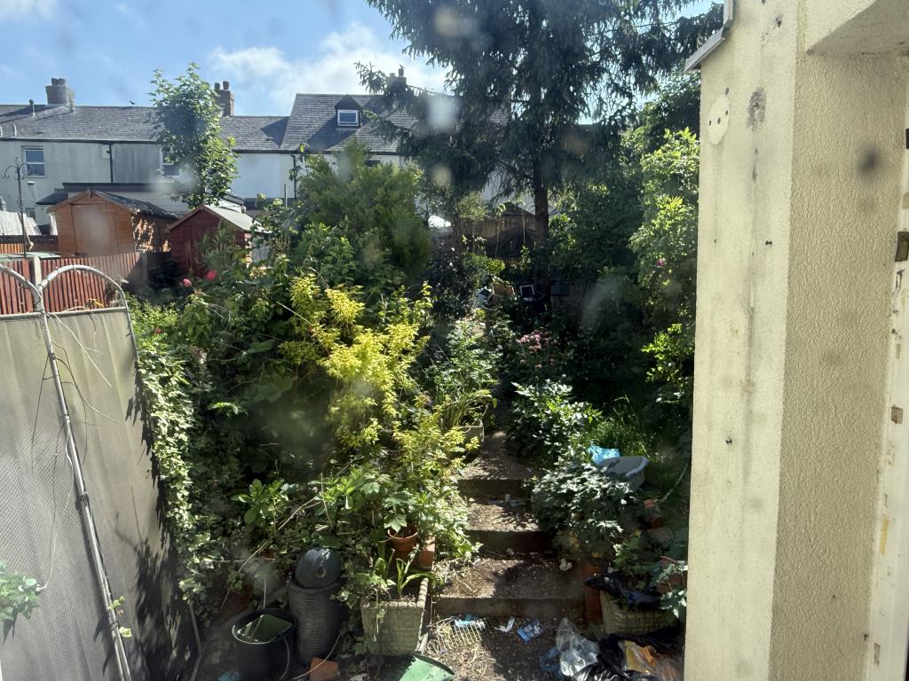 Lot: 104 - HOUSE IN NEED OF IMPROVEMENT - Rear Garden of house in need of refurbishment